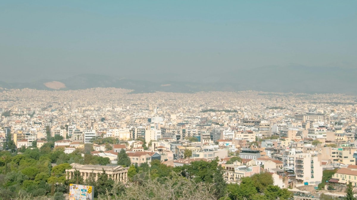 a view of a city from the top of a hill